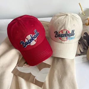 Red and beige Baseball Mom cotton baseball caps with embroidery on a lifestyle background