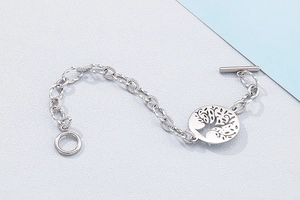 Detail of silver stainless steel tree of life bracelet with vintage OT toggle clasp