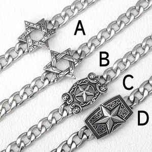 Detailed view of silver stainless steel Cuban link bracelets with star and shield charms