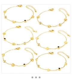 Detail view of 6-piece gold chain bracelet set with butterfly and heart charms