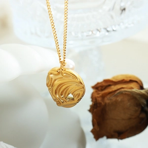 Irregular gold abstract pendant necklace with freshwater pearl and textured finish