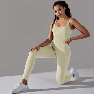 Macro view of seamless ribbed knit fabric on a slim fit beige fitness yoga unitard