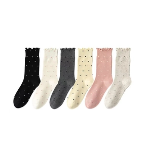 Polka dot crew socks for women with ruffled edges in six assorted pastel colors