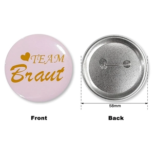 Pink and gold Team Braut 58mm tinplate badges showing front and back view