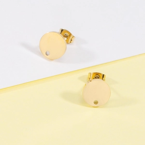 Detail of gold round flat base stud earring components for DIY jewelry making