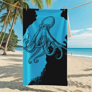 Blue octopus print microfiber beach towel hanging on palm trees with tropical beach background