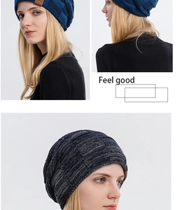 Close-up of blue and grey mixed knit beanie with brown leather patch detail