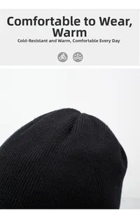 Detailed close-up of black ribbed knit winter beanie highlighting soft texture and warmth