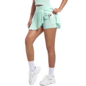 Detail view of mint green tennis skirt featuring a hidden phone pocket in the inner shorts