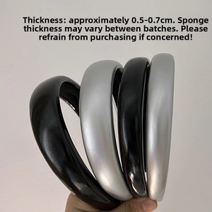 Detail view of black and silver faux leather headbands showing 2cm and 3cm widths