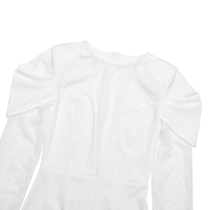 Detailed close-up of white long sleeve dress with V-neck lace patchwork and puff sleeves