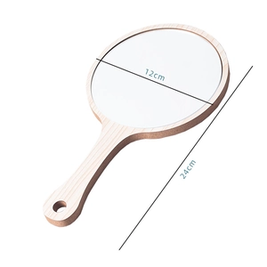 Macro view of 12cm round wooden hand mirror showing detailed dimensions and natural texture