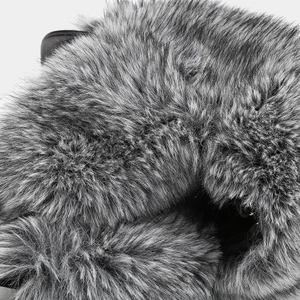 Detailed macro view of high-density long faux fur texture in gradient grey tones