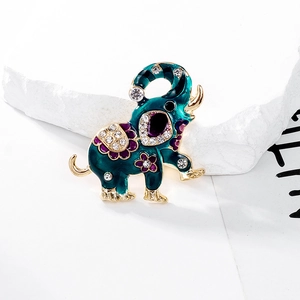 Close-up of elephant brooch with dark green enamel and sparkling rhinestones