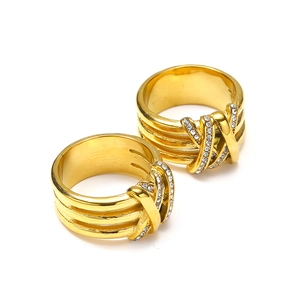 18k gold multilayered crossover ring with crystals on a clean white background