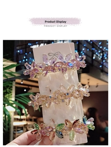Detailed view of floral crystal hair clips with alloy spring base and rhinestones