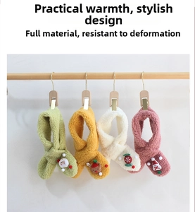 Detail showing four plush Christmas scarves with festive cartoon charms on a hanger