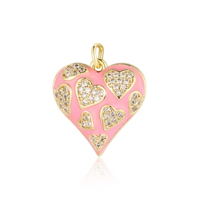 Detail of pink enamel heart pendant with sparkling rhinestones and gold ring connector