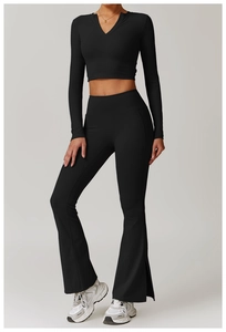 Detailed front view of black slim-fit V-neck yoga top and flared leggings set