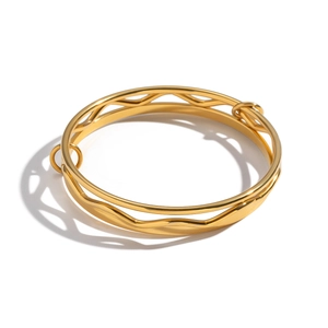 Minimalist double-layered gold wave bangle in waterproof stainless steel with open design