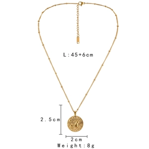Macro detail of gold zodiac coin necklace with 45+6cm chain length and 8g weight