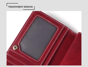 Detailed close-up of dark red leather wallet interior with card slots and a transparent window