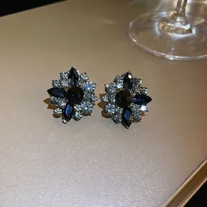 French vintage floral stud earrings with navy blue gems and sparkling crystals