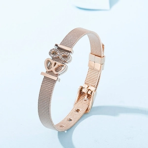 Detail of rose gold mesh bracelet with pavé zircon infinity and double heart charms