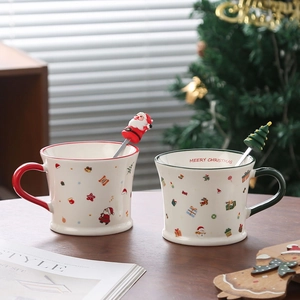 Christmas Santa Claus ceramic coffee mug set with green and red handles and matching spoons