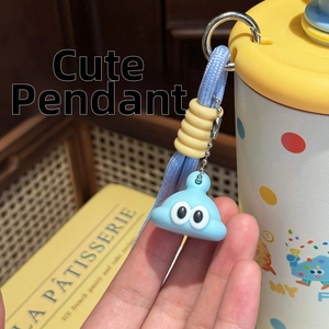 Close-up of cute blue slime cartoon charm with braided strap for water bottle decoration