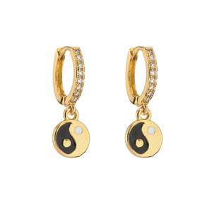 Detailed view of gold plated hoop earrings with zircon stones and yin yang charms