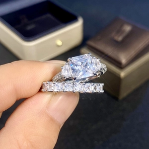 Close-up of luxury square-cut zircon ring and eternity band in sterling silver