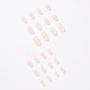 French style oval press-on nails with white tips and yellow diagonal stripe accents
