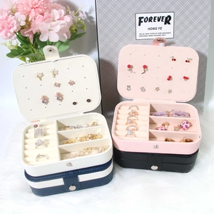 Portable double-layer jewelry box organizer for rings and necklaces in cream and pink