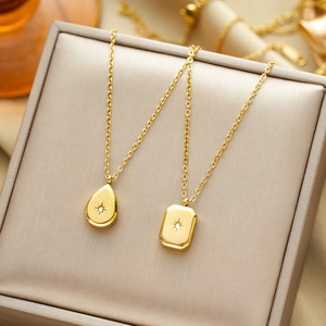 Minimalist gold titanium steel necklaces with starburst pendants and cubic zirconia