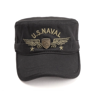 Close-up of black military cap with U.S. Naval embroidery and U.S. Army metal badge