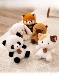 Close-up of fluffy animal plush collection with cute embroidery and logo tags