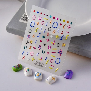 Close-up of 5D embossed nail art stickers with colorful doodle lines and cute symbols