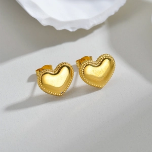 Elegant gold-plated irregular heart stud earrings with vintage milgrain textured edges