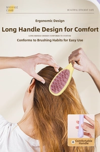 Detail showing the ergonomic long handle and pink soft massage bristles on the comb