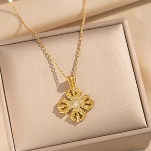 Luxurious gold vajra cross necklace with cubic zirconia in a jewelry gift box