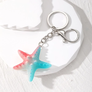 Colorful gradient starfish keychain with resin texture and silver metal ring on white background