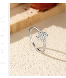 Macro detail of S925 sterling silver clover ring featuring shimmering pavé set zircons