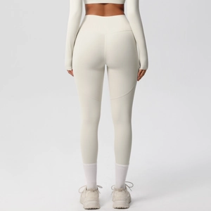Rear view of high-waisted yoga pants with butt-lifting seams in a creamy white finish
