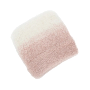 Detailed macro view of ombre pink and white faux fur texture on a square plush cushion cover