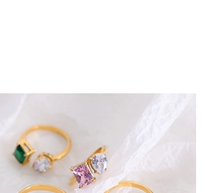 Detail of 18K gold-plated open ring with green and pink zircon gemstone inlay