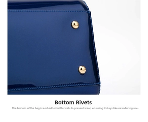 Detail shot of the glossy navy patent leather bottom with protective gold metal studs