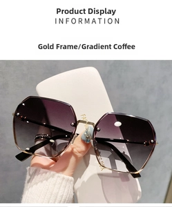 Detailed macro of rimless gold metal frame sunglasses with gradient coffee lenses
