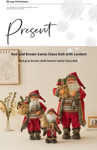 Three sizes of standing Santa Claus dolls in red fabric with lanterns and gift bags