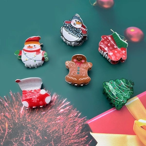 Christmas hair clips collection featuring snowman and gingerbread man acrylic claw clips